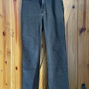 Abercrombie & Fitch Black Flare Jeans in the front and “Leather” in the Back.